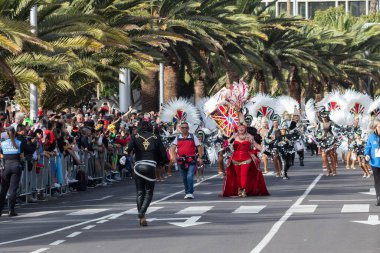 SANTA CRUZ DE TENERIFE, SPAIN - FEBRUARY 21, 2023: Coso parade - along the Avenida de Anaga, official end of Carnival. Again march carnival groups, floats, decorated cars and the Carnival Queens.