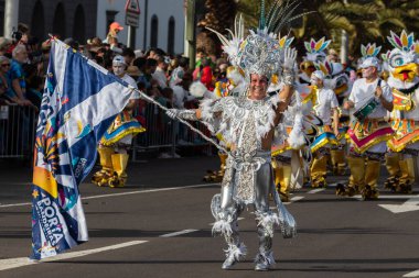 SANTA CRUZ DE TENERIFE, SPAIN - FEBRUARY 21, 2023: Coso parade - along the Avenida de Anaga, official end of Carnival. Again march carnival groups, floats, decorated cars and the Carnival Queens.