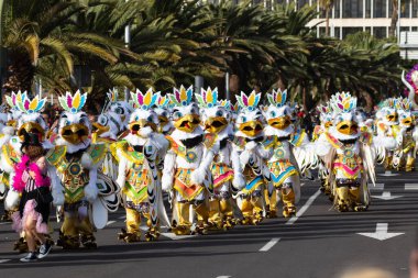 SANTA CRUZ DE TENERIFE, SPAIN - FEBRUARY 21, 2023: Coso parade - along the Avenida de Anaga, official end of Carnival. Again march carnival groups, floats, decorated cars and the Carnival Queens.