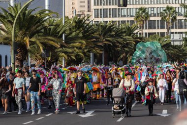 SANTA CRUZ DE TENERIFE, SPAIN - FEBRUARY 21, 2023: Coso parade - along the Avenida de Anaga, official end of Carnival. Again march carnival groups, floats, decorated cars and the Carnival Queens.