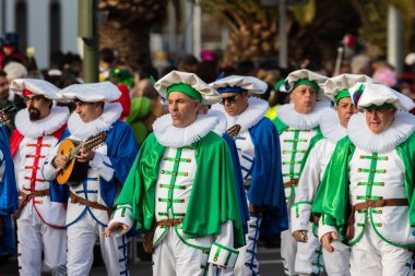 SANTA CRUZ DE TENERIFE, SPAIN - FEBRUARY 21, 2023: Coso parade - along the Avenida de Anaga, official end of Carnival. Again march carnival groups, floats, decorated cars and the Carnival Queens.
