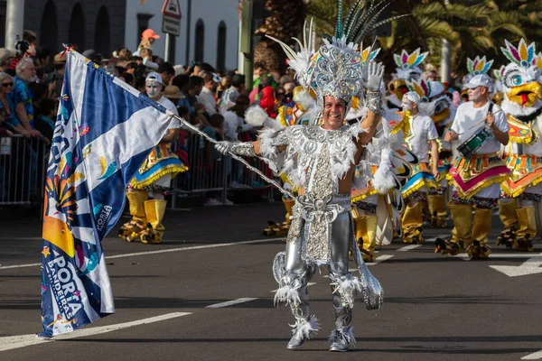 SANTA CRUZ DE TENERIFE, SPAIN - FEBRUARY 21, 2023: Coso parade - along the Avenida de Anaga, official end of Carnival. Again march carnival groups, floats, decorated cars and the Carnival Queens.