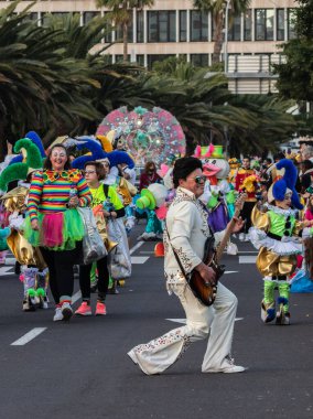 SANTA CRUZ DE TENERIFE, SPAIN - FEBRUARY 21, 2023: Coso parade - along the Avenida de Anaga, official end of Carnival. Again march carnival groups, floats, decorated cars and the Carnival Queens.