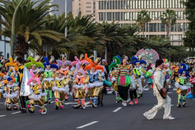 SANTA CRUZ DE TENERIFE, SPAIN - FEBRUARY 21, 2023: Coso parade - along the Avenida de Anaga, official end of Carnival. Again march carnival groups, floats, decorated cars and the Carnival Queens.