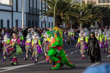 SANTA CRUZ DE TENERIFE, SPAIN - FEBRUARY 21, 2023: Coso parade - along the Avenida de Anaga, official end of Carnival. Again march carnival groups, floats, decorated cars and the Carnival Queens.