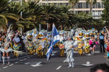 SANTA CRUZ DE TENERIFE, SPAIN - FEBRUARY 21, 2023: Coso parade - along the Avenida de Anaga, official end of Carnival. Again march carnival groups, floats, decorated cars and the Carnival Queens.