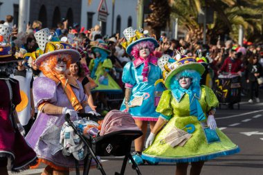 SANTA CRUZ DE TENERIFE, SPAIN - FEBRUARY 21, 2023: Coso parade - along the Avenida de Anaga, official end of Carnival. Again march carnival groups, floats, decorated cars and the Carnival Queens.