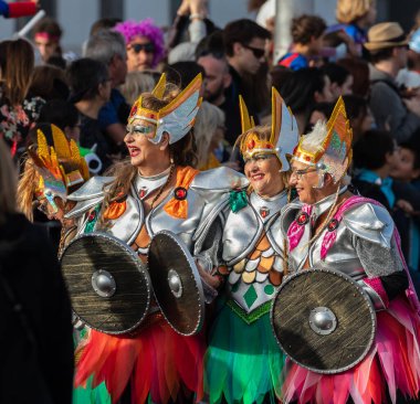 SANTA CRUZ DE TENERIFE, SPAIN - FEBRUARY 21, 2023: Coso parade - along the Avenida de Anaga, official end of Carnival. Again march carnival groups, floats, decorated cars and the Carnival Queens.