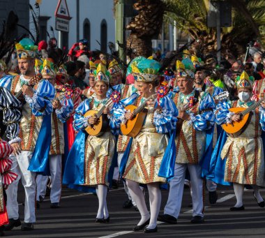 SANTA CRUZ DE TENERIFE, SPAIN - FEBRUARY 21, 2023: Coso parade - along the Avenida de Anaga, official end of Carnival. Again march carnival groups, floats, decorated cars and the Carnival Queens.