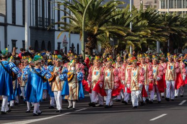 SANTA CRUZ DE TENERIFE, SPAIN - FEBRUARY 21, 2023: Coso parade - along the Avenida de Anaga, official end of Carnival. Again march carnival groups, floats, decorated cars and the Carnival Queens.