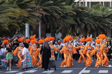 SANTA CRUZ DE TENERIFE, SPAIN - FEBRUARY 21, 2023: Coso parade - along the Avenida de Anaga, official end of Carnival. Again march carnival groups, floats, decorated cars and the Carnival Queens.
