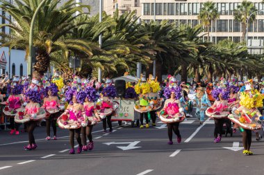 SANTA CRUZ DE TENERIFE, SPAIN - FEBRUARY 21, 2023: Coso parade - along the Avenida de Anaga, official end of Carnival. Again march carnival groups, floats, decorated cars and the Carnival Queens.