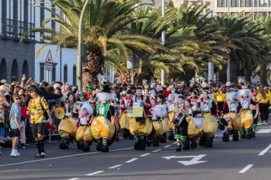 SANTA CRUZ DE TENERIFE, SPAIN - FEBRUARY 21, 2023: Coso parade - along the Avenida de Anaga, official end of Carnival. Again march carnival groups, floats, decorated cars and the Carnival Queens.