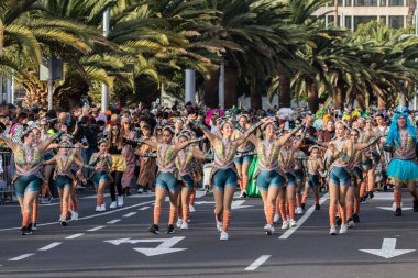 SANTA CRUZ DE TENERIFE, SPAIN - FEBRUARY 21, 2023: Coso parade - along the Avenida de Anaga, official end of Carnival. Again march carnival groups, floats, decorated cars and the Carnival Queens.