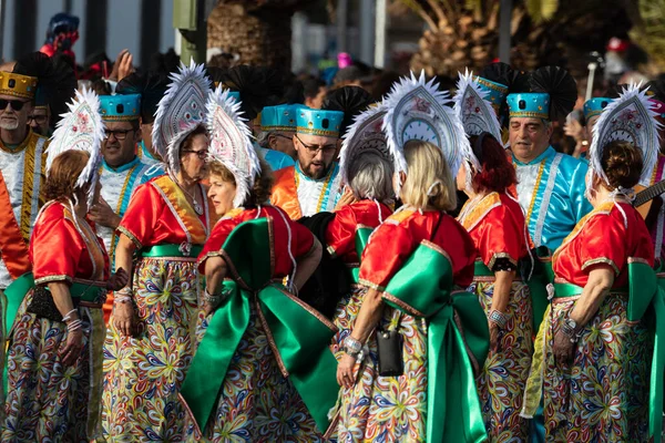 SANTA CRUZ DE TENERIFE, SPAIN - FEBRUARY 21, 2023: Coso parade - along the Avenida de Anaga, official end of Carnival. Again march carnival groups, floats, decorated cars and the Carnival Queens.