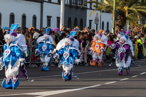 SANTA CRUZ DE TENERIFE, SPAIN - FEBRUARY 21, 2023: Coso parade - along the Avenida de Anaga, official end of Carnival. Again march carnival groups, floats, decorated cars and the Carnival Queens.