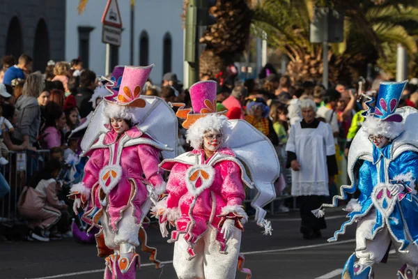 SANTA CRUZ DE TENERIFE, SPAIN - FEBRUARY 21, 2023: Coso parade - along the Avenida de Anaga, official end of Carnival. Again march carnival groups, floats, decorated cars and the Carnival Queens.