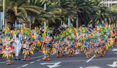 SANTA CRUZ DE TENERIFE, SPAIN - FEBRUARY 21, 2023: Coso parade - along the Avenida de Anaga, official end of Carnival. Again march carnival groups, floats, decorated cars and the Carnival Queens.