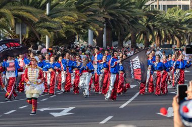 SANTA CRUZ DE TENERIFE, SPAIN - FEBRUARY 21, 2023: Coso parade - along the Avenida de Anaga, official end of Carnival. Again march carnival groups, floats, decorated cars and the Carnival Queens.