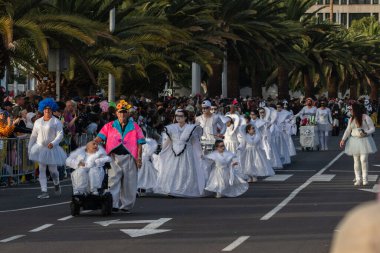 SANTA CRUZ DE TENERIFE, SPAIN - FEBRUARY 21, 2023: Coso parade - along the Avenida de Anaga, official end of Carnival. Again march carnival groups, floats, decorated cars and the Carnival Queens.
