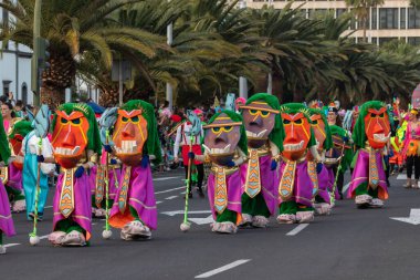 SANTA CRUZ DE TENERIFE, SPAIN - FEBRUARY 21, 2023: Coso parade - along the Avenida de Anaga, official end of Carnival. Again march carnival groups, floats, decorated cars and the Carnival Queens.