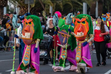 SANTA CRUZ DE TENERIFE, SPAIN - FEBRUARY 21, 2023: Coso parade - along the Avenida de Anaga, official end of Carnival. Again march carnival groups, floats, decorated cars and the Carnival Queens.