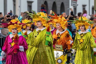SANTA CRUZ DE TENERIFE, SPAIN - FEBRUARY 21, 2023: Coso parade - along the Avenida de Anaga, official end of Carnival. Again march carnival groups, floats, decorated cars and the Carnival Queens.