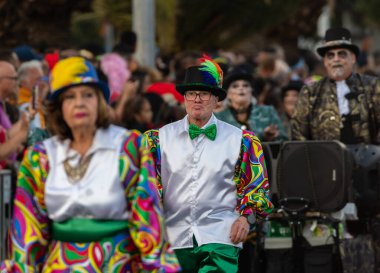 SANTA CRUZ DE TENERIFE, SPAIN - FEBRUARY 21, 2023: Coso parade - along the Avenida de Anaga, official end of Carnival. Again march carnival groups, floats, decorated cars and the Carnival Queens.