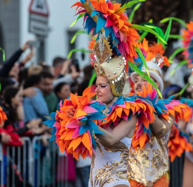 SANTA CRUZ DE TENERIFE, SPAIN - FEBRUARY 21, 2023: Coso parade - along the Avenida de Anaga, official end of Carnival. Again march carnival groups, floats, decorated cars and the Carnival Queens.