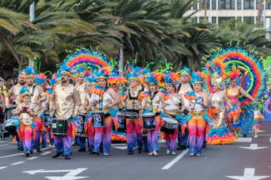 SANTA CRUZ DE TENERIFE, SPAIN - FEBRUARY 21, 2023: Coso parade - along the Avenida de Anaga, official end of Carnival. Again march carnival groups, floats, decorated cars and the Carnival Queens.