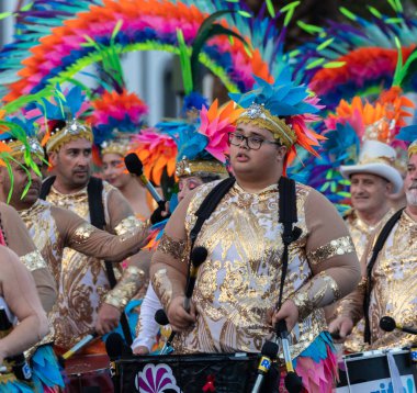SANTA CRUZ DE TENERIFE, SPAIN - FEBRUARY 21, 2023: Coso parade - along the Avenida de Anaga, official end of Carnival. Again march carnival groups, floats, decorated cars and the Carnival Queens.