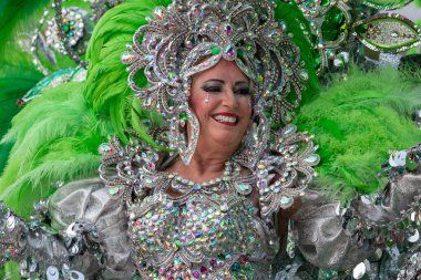 SANTA CRUZ DE TENERIFE, SPAIN - FEBRUARY 21, 2023: Coso parade - along the Avenida de Anaga, official end of Carnival. Again march carnival groups, floats, decorated cars and the Carnival Queens.