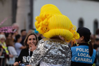 SANTA CRUZ DE TENERIFE, SPAIN - FEBRUARY 21, 2023: Coso parade - along the Avenida de Anaga, official end of Carnival. Again march carnival groups, floats, decorated cars and the Carnival Queens.
