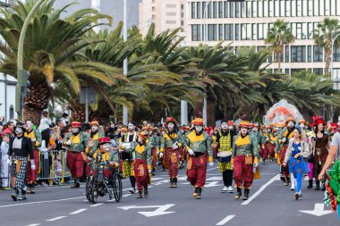 SANTA CRUZ DE TENERIFE, SPAIN - FEBRUARY 21, 2023: Coso parade - along the Avenida de Anaga, official end of Carnival. Again march carnival groups, floats, decorated cars and the Carnival Queens.