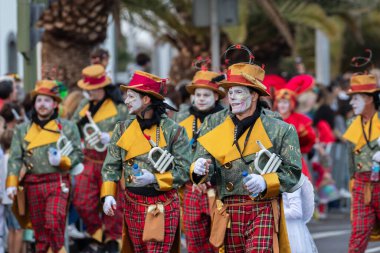 SANTA CRUZ DE TENERIFE, SPAIN - FEBRUARY 21, 2023: Coso parade - along the Avenida de Anaga, official end of Carnival. Again march carnival groups, floats, decorated cars and the Carnival Queens.