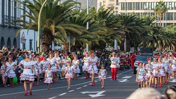 SANTA CRUZ DE TENERIFE, SPAIN - FEBRUARY 21, 2023: Coso parade - along the Avenida de Anaga, official end of Carnival. Again march carnival groups, floats, decorated cars and the Carnival Queens.