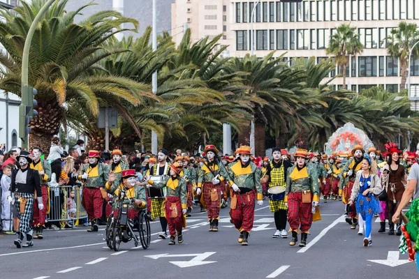 SANTA CRUZ DE TENERIFE, SPAIN - FEBRUARY 21, 2023: Coso parade - along the Avenida de Anaga, official end of Carnival. Again march carnival groups, floats, decorated cars and the Carnival Queens.