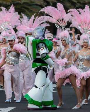 SANTA CRUZ DE TENERIFE, SPAIN - FEBRUARY 21, 2023: Coso parade - along the Avenida de Anaga, official end of Carnival. Again march carnival groups, floats, decorated cars and the Carnival Queens.