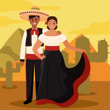 Geleneksel charro ve folklor kostümlü Meksikalı çift çölde poz veriyor.