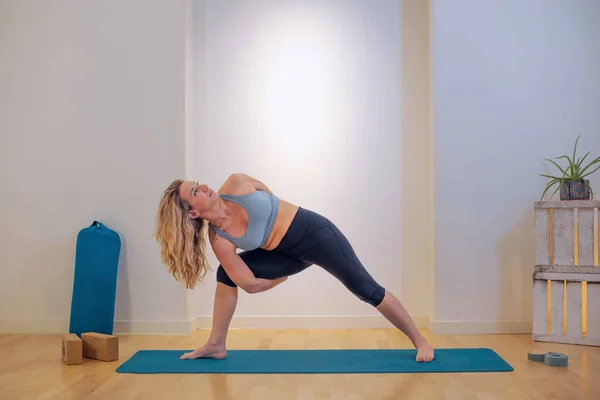 Caucasian Female Athlete Performing Yoga Position Studio Fotografie de stoc
