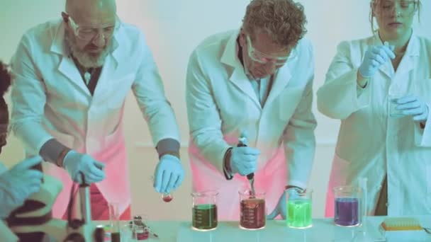 Focused Team Conducts Chemical Experiment Researchers Safety Gear Work Vibrant — Stock Video