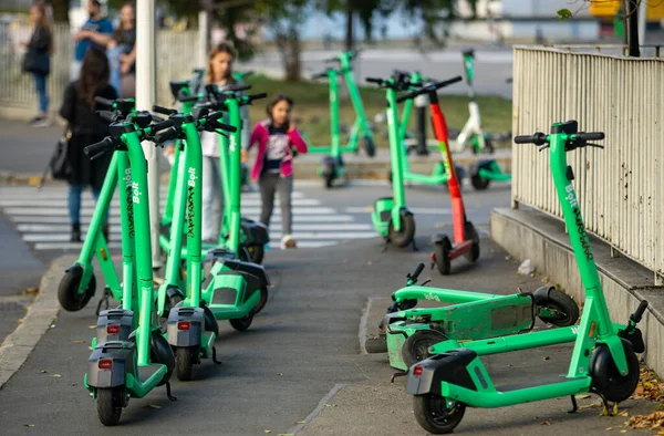 stock image Bucharest, Romania - October 07, 2022: Bolt electric scooters are wrongly parked blocking access on the sidewalk in Bucharest. This image is for editorial use only.