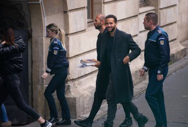 Bucharest, Romania - January 10, 2023: Andrew Tate and his brother Tristan arrived in handcuffs at the Bucharest Court of Appeal for their appeal against the 30-day arrest for human trafficking.
