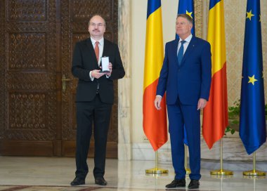 Bucharest, Romania - January 13, 2023: Narcis Dorin Ion receives a decoration for Peles National Museum from the President of Romania Klaus Iohannis on the occasion of the National Culture Day.