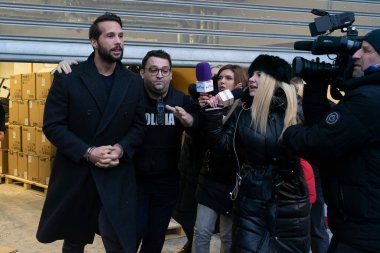 Bucharest, Romania - January 25, 2023: Tristan Tate and his brother leave the Directorate for Investigating Organized Crime and Terrorism DIICOT where their phones and laptops were searched