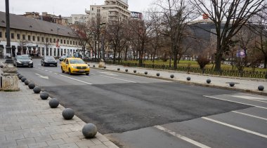 Bucharest, Romania - January 25, 2023: A large patch of asphalt on Splaiul Independentei next to Halelor Street in 
