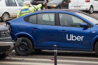 Bucharest, Romania - March 02, 2023: An Uber logo branded car on the road at the place where it was involved in a car accident. This image is for editorial use only.