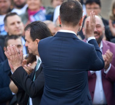 Bucharest, Romania. 17th Mar, 2024: Ludovic Orban (L), president of Force of the Right (FD), and Catalin Drula (R), Save Romania Union President, applaud during a signature gathering event clipart