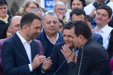 Bucharest, Romania. 17th Mar, 2024: (L-R) Catalin Drula, USR President, Nicusor Dan, the Mayor of Bucharest, and Ludovic Orban, speak during a signature gathering event clipart