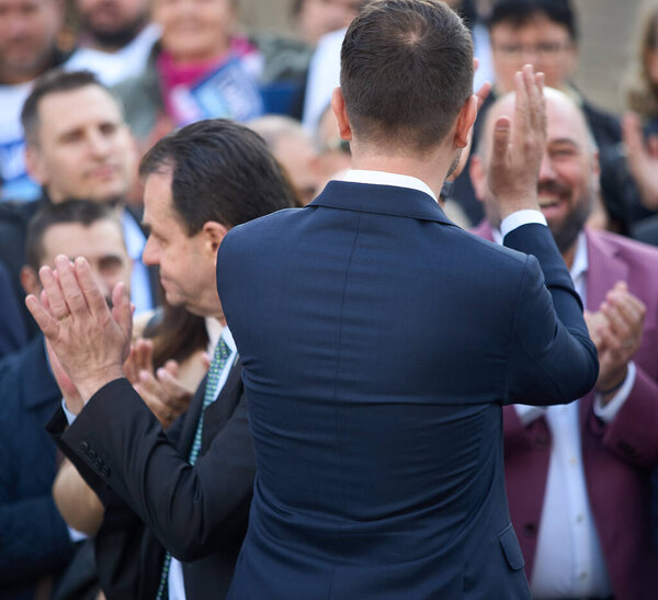 Bucharest, Romania. 17th Mar, 2024: Ludovic Orban (L), president of Force of the Right (FD), and Catalin Drula (R), Save Romania Union President, applaud during a signature gathering event